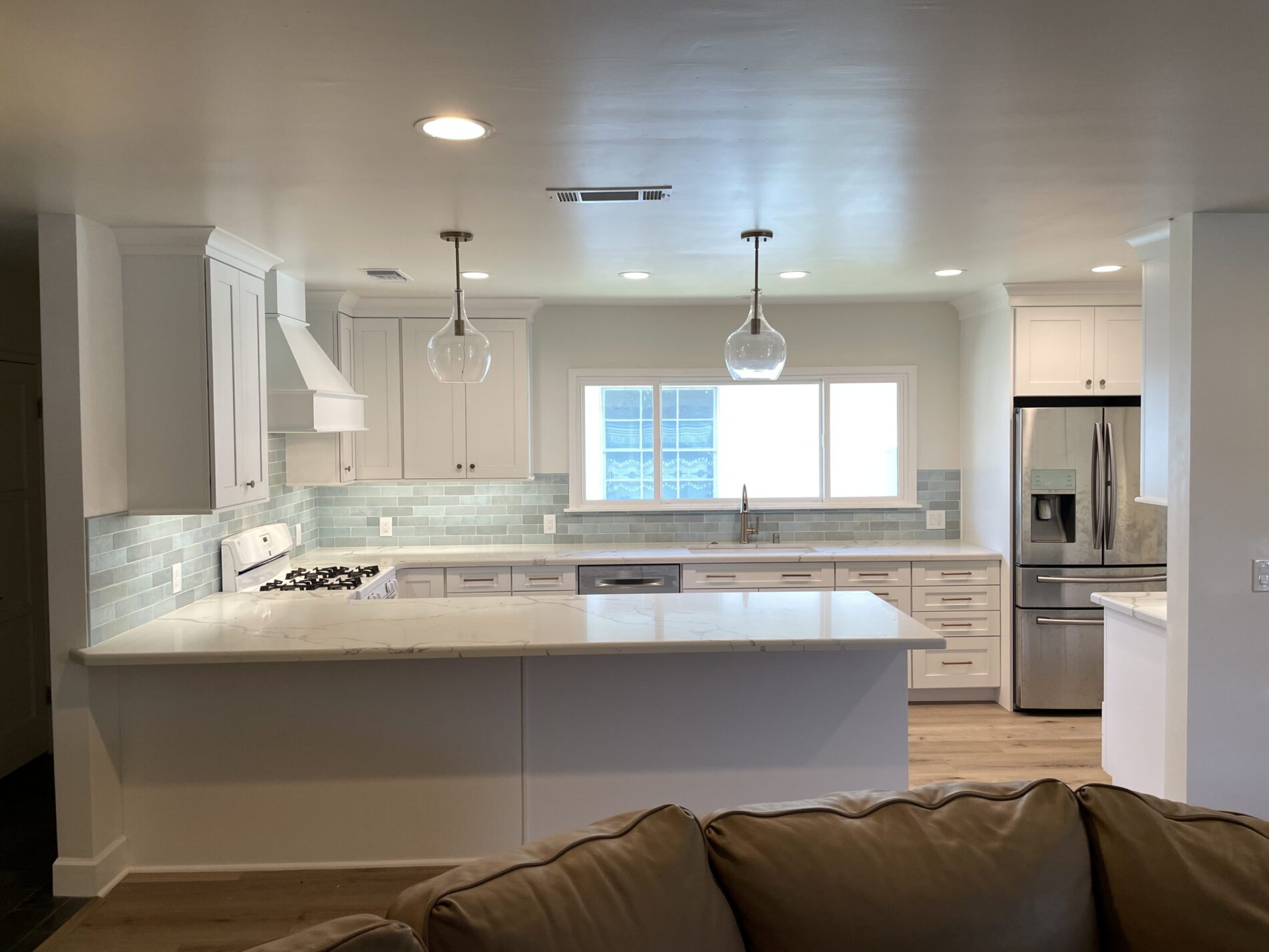 Modern kitchen with white cabinetry.